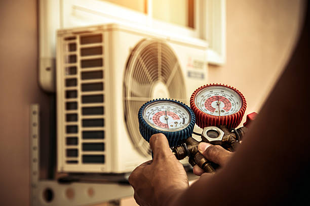 Professional Heat Pump Repair technician working in Bolton, MA